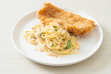 spaghetti pasta white cream sauce with fried fish