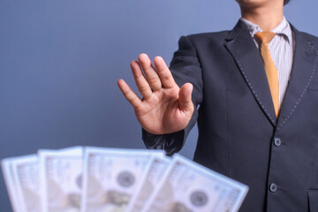 Businessman refusing money offered by a man. Anti bribery and corruption concepts