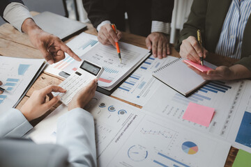 Team of analyst working on financial data analysis dashboard on paper as marketing indication for business strategic planning, Insight, They are calculating the taxes they have to pay,