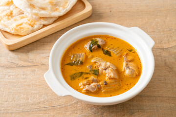 Chicken curry soup with roti