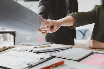 Close up of a group of business people putting their hands together, stack of hands, unity and teamwork concept, investment concept, success concept, meeting team are putting hands together,