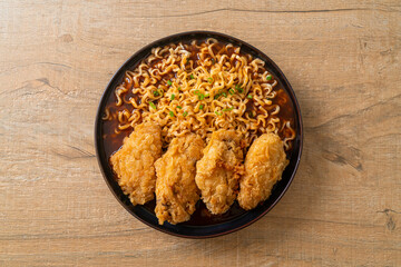 Korean instant noodles with fried chicken or Fried chicken ramyeon