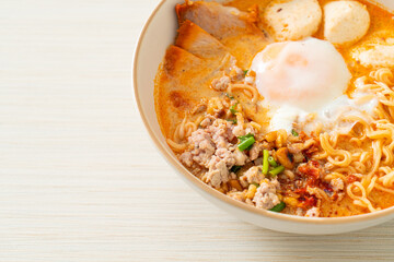 instant noodles with pork and meatballs in spicy soup