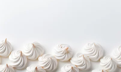 Gordijnen French vanilla Meringues arrangement on white background. © Mangsaab
