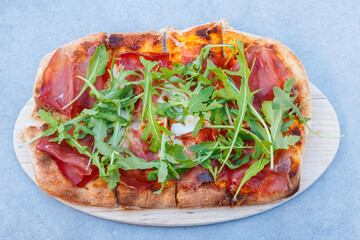 Tasty pinsa on a table. Top view