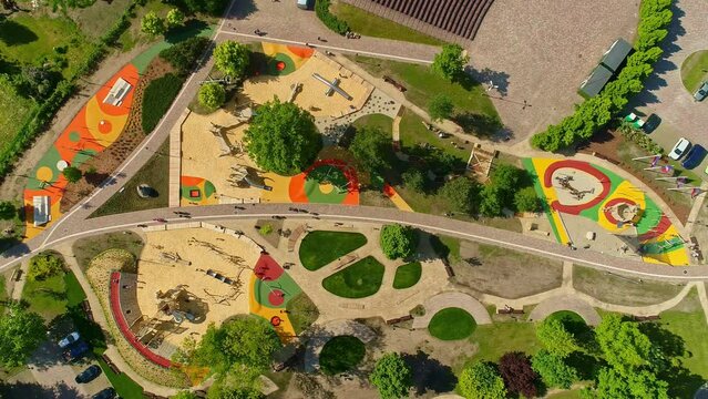 Overhead View Of Kids Playing At Children's Playground In Uzvaras Parks, Jelgava, Latvia. - aerial shot