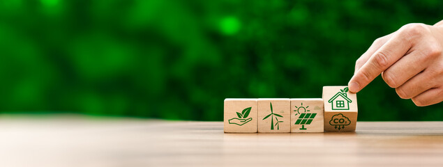 Eco-friendly houses prioritize sustainability. Utilize energy-efficient design, renewable energy sources, Green House, Concept the development of sustainable construction technologies and green living © Sutthiphong