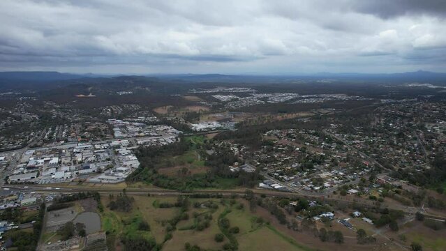 Cloudy Skies Over Loganholme Suburb In The City Of Logan In Queensland, Australia. aerial sideways shot