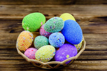 Easter eggs made of styrofoam on a wooden background