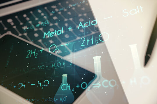 Creative chemistry hologram on modern laptop background, pharmaceutical research concept. Multiexposure