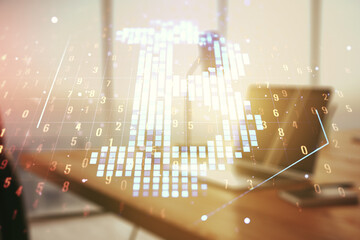 Double exposure of creative Bitcoin symbol with modern laptop on background. Cryptocurrency concept