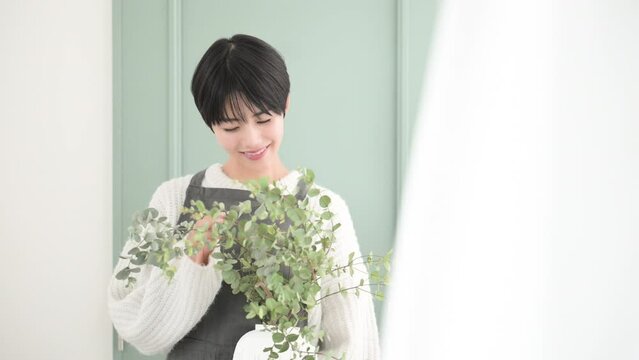 Animation of an image of a florist store saleswoman with a vase of flowers and a woman with a vegetable garden.