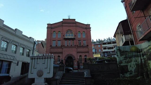 The great synagogue of Tbilisi the holy religious place of worship for Jewish in Georgian Caucasus in down town the historical building ancient architecture brick building ceremony of Hanukah