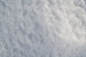 white texture of snow on a snowdrift on a cold winter day