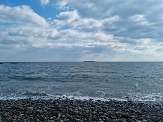 It is a beach with round pebbles.