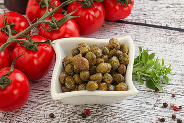 Marinated green capers in the bowl