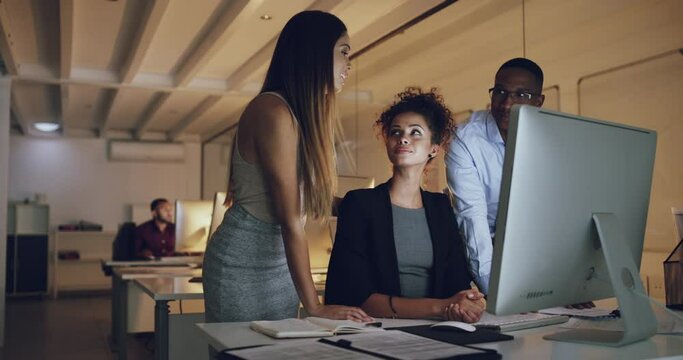 Business people, computer and night teamwork, online planning or website design collaboration in office. Professional group, manager or employees on desktop for marketing review, research or feedback