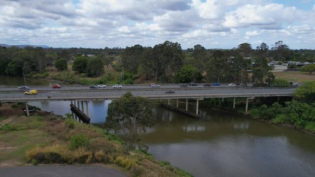 Traffic On Larry Storey Bridge Across Logan River. Pacific Motorway In Waterford, Queensland, Australia. aerial descending shot