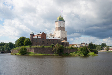 Fototapeta na wymiar Vyborg castle under a large cloudy sky day in august