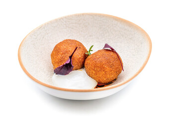 Homemade Fried Sicilian Arancini stuffed with meat, with tomato sauce
