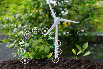 The wind turbine is a symbol of hope for the future, and the green globe represents a brighter...