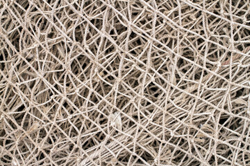 Old fishing net close-up. Texture of an old fishing net.
