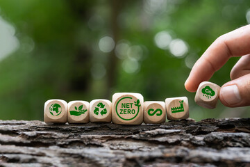 Net zero icon and carbon neutral concept, 2050 goal, long term climate neutral strategy. Wooden block with green icon Net zero greenhouse gas emissions Climate. - obrazy, fototapety, plakaty