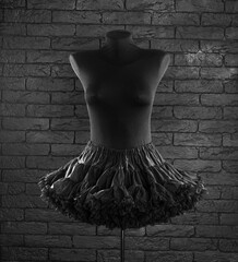 black ballet skirt with ruffles on a mannequin