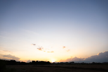 Beautiful sky and cloud at high. Landscape include space, light of nature, sunset, sunrise, horizon or skyline. Colorful with yellow, orange and blue at evening in autumn for background and wallpaper.
