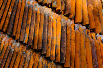 Background Photography. Textured Background. Photo of pile of used roof tiles. Close up photo of a pile of mossy roof tiles. Bandung - Indonesia, Asia