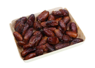 Dried sweet Egyptian dates in a box isolated