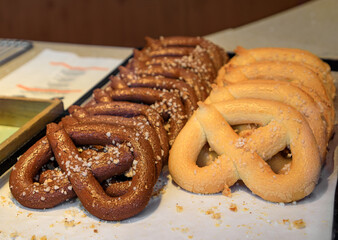 Savory pretzel or bretzel with sea salt for sale at a French bakery in Kaysersberg, France, a village on the Alsatian Wine Route