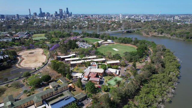 University of Queensland Playing Fields On The Banks Of Brisbane River Near Eleanor Schonell Bridge. Dutton Park In Brisbane, Australia. aerial pullback shot
