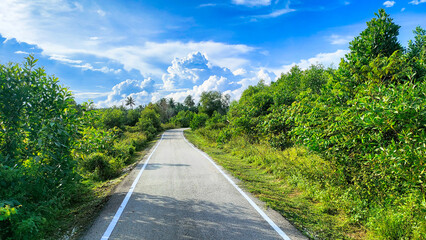 Pantai Sepat, Kuantan Pahang, Malaysia - November 29, 2023: Blue line marking the Cycle road path...