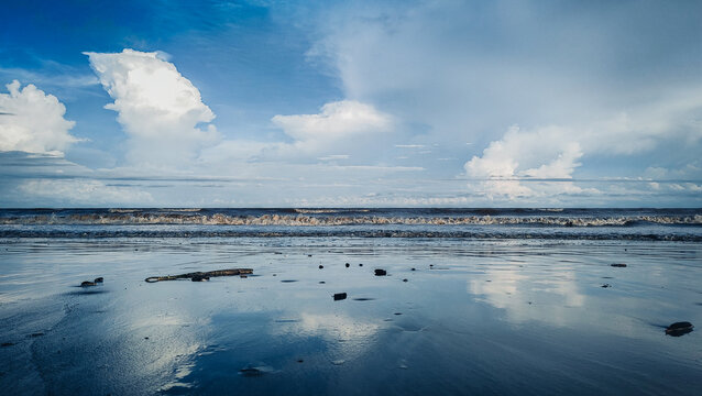 Ocean waves and beach with sand on Pantai Anak Air, Kuantan Pahang, Malaysia.
