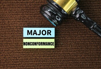 judge's gavel and colored paper with the words Major Nonconformance