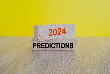 2024 predictions symbol. Concept orange words 2024 predictions on brick blocks. Beautiful wooden...