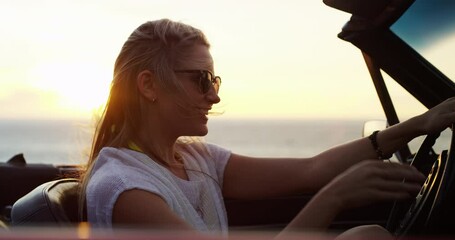 Woman, road trip and freedom at sunset at the sea in a car with drive for holiday, adventure and travel outdoor. Transport, wind and ocean with vacation and nature with a female driver in a vehicle