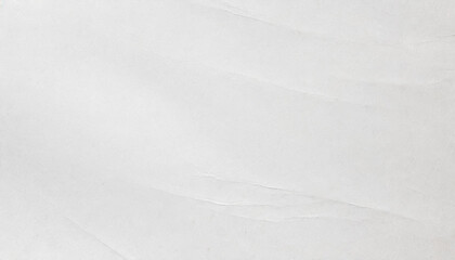 Obraz premium A soft, white, elegant paper texture with delicate creases and fine details, subtly wrinkled paper texture ideal for elegant designs.