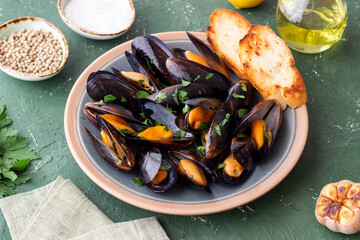 Cooked mussels with oil and parsley. Sea food. Healthy eating. Diet.