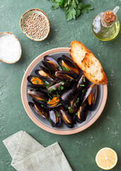 Cooked mussels with oil and parsley. Sea food. Healthy eating. Diet.