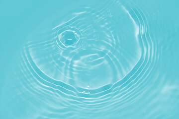 The surface of the water dripped and rippled in the basin. The transparent blue water surface is...