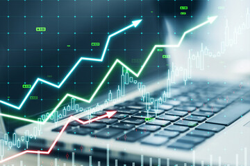 Close up of laptop with growing upward chart, map, arrows and forex graph on blurry background. Global trends, trading and finance concept. Double exposure.