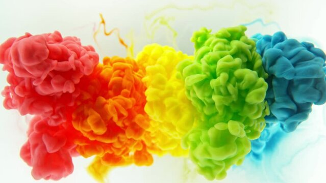 Super Slow Motion of Colored Paints Mixing in Water. Isolated on White Background. Filmed on High Speed Cinema Camera, 1000fps.
