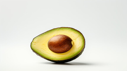 An avocado photographed alone on a plain white backdrop