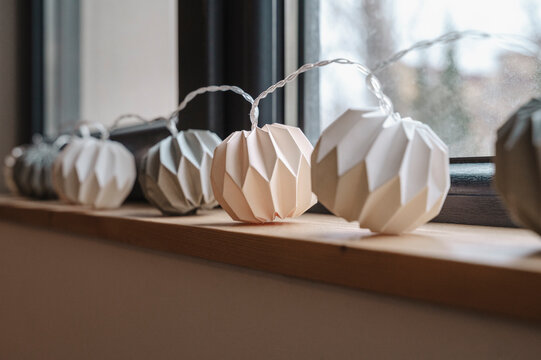 White paper garland decorated on window sill