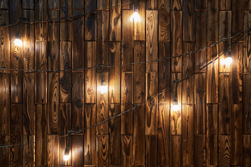Background from a wooden wall and retro garland