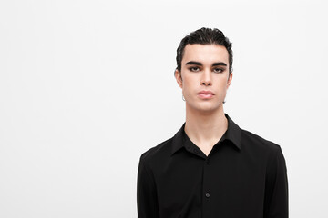 Young man wearing black shirt against white background