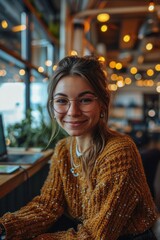 Young professional exuding confidence, seated with a genuine smile