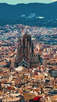 Aerial view of Barcelona Eixample district and Sagrada Familia Basilica, Spain. Aerial vertical,&nbsp;vertical video background.